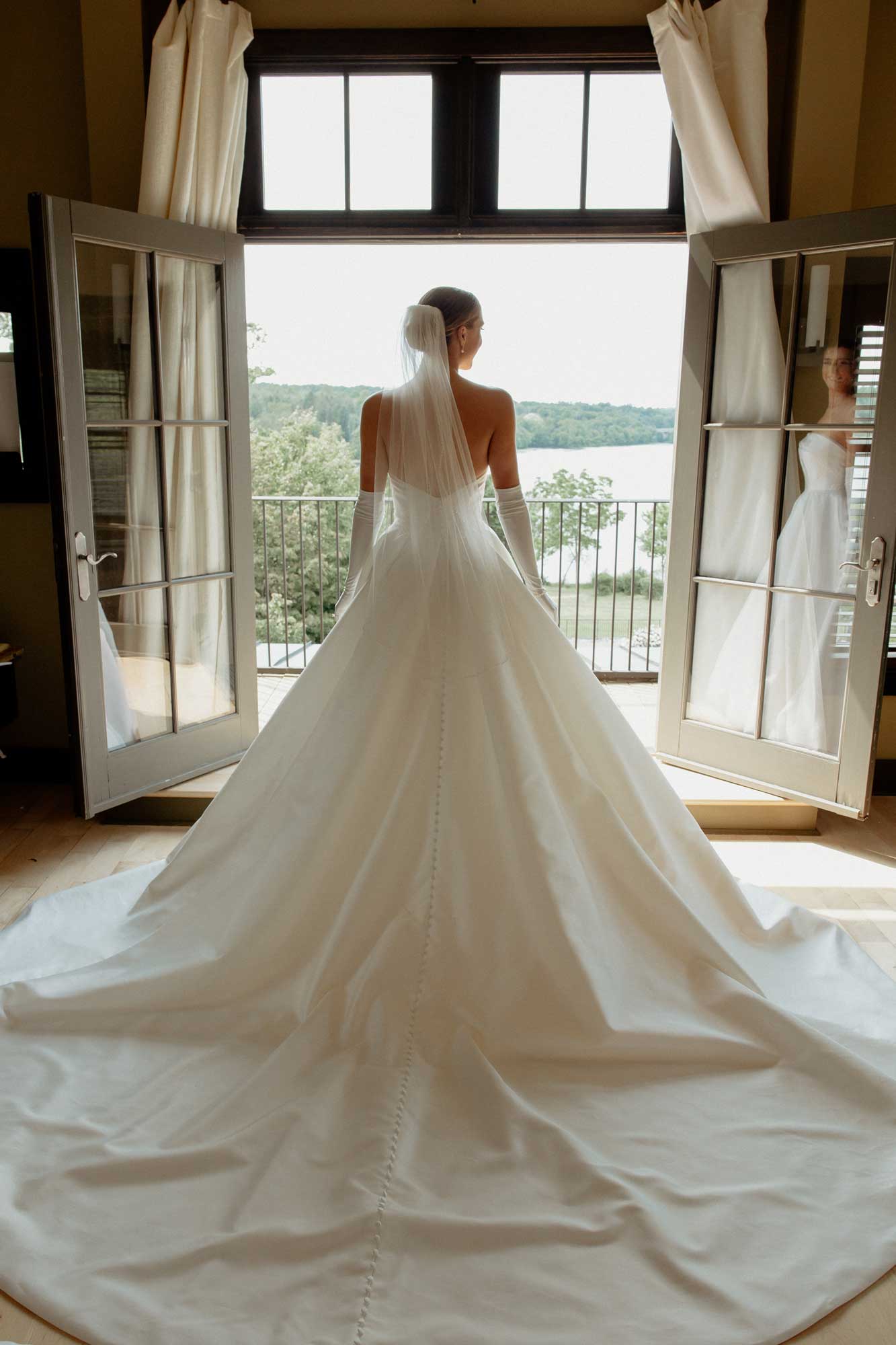 bride-before-wedding-ceremony-looking-out-balcony